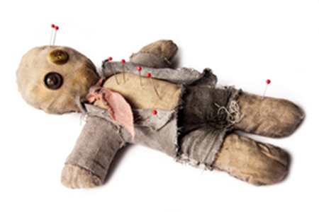 Photo of Businessman voodoo doll laying on white